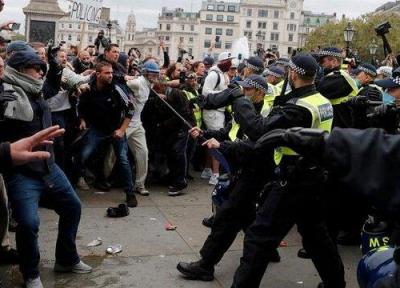 درگیری میان پلیس انگلیس و معترضان به وضع محدودیت های اجتماعی در لندن